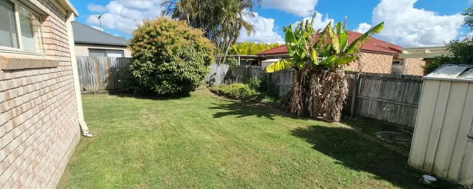 Large back yard freshly mown and edged in Collingwood Park, Ipswich