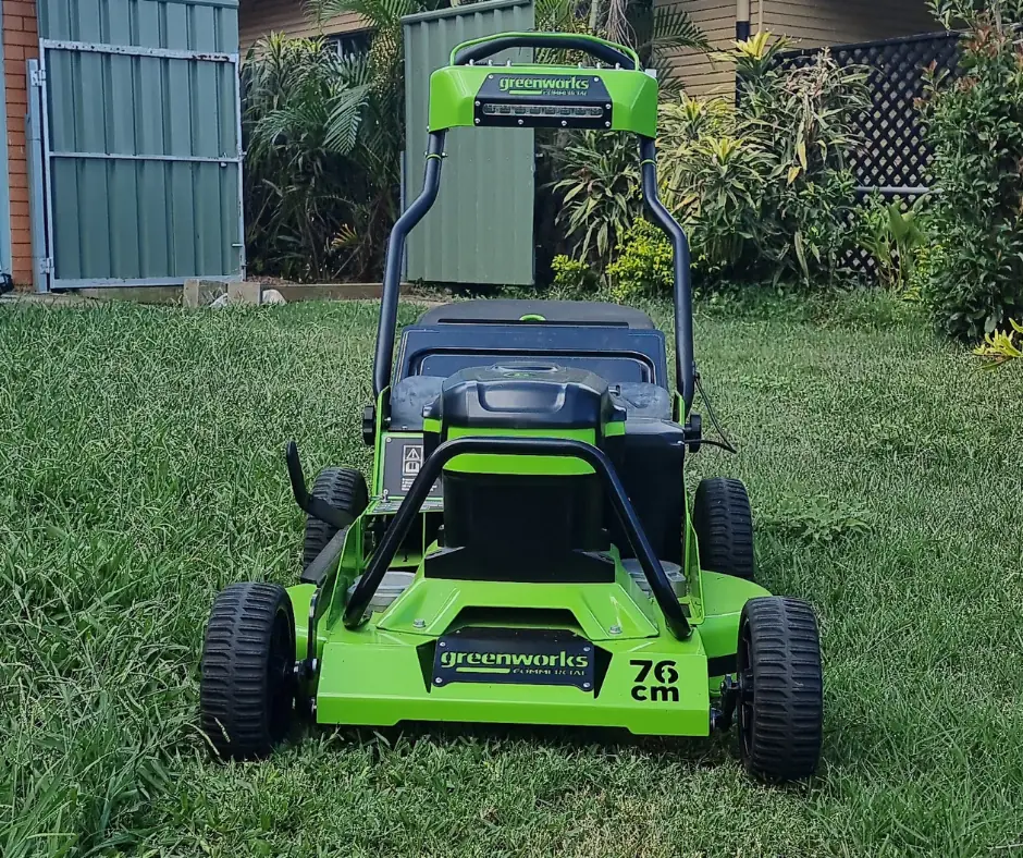 Commercial lawn mower on a freshly cut front lawn in Ipswich, part of a scheduled Beg Your Garden mowing visit