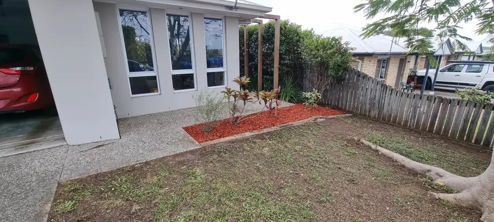 Front yard lawn mowing and garden bed mulching by Beg Your Garden in Ipswich